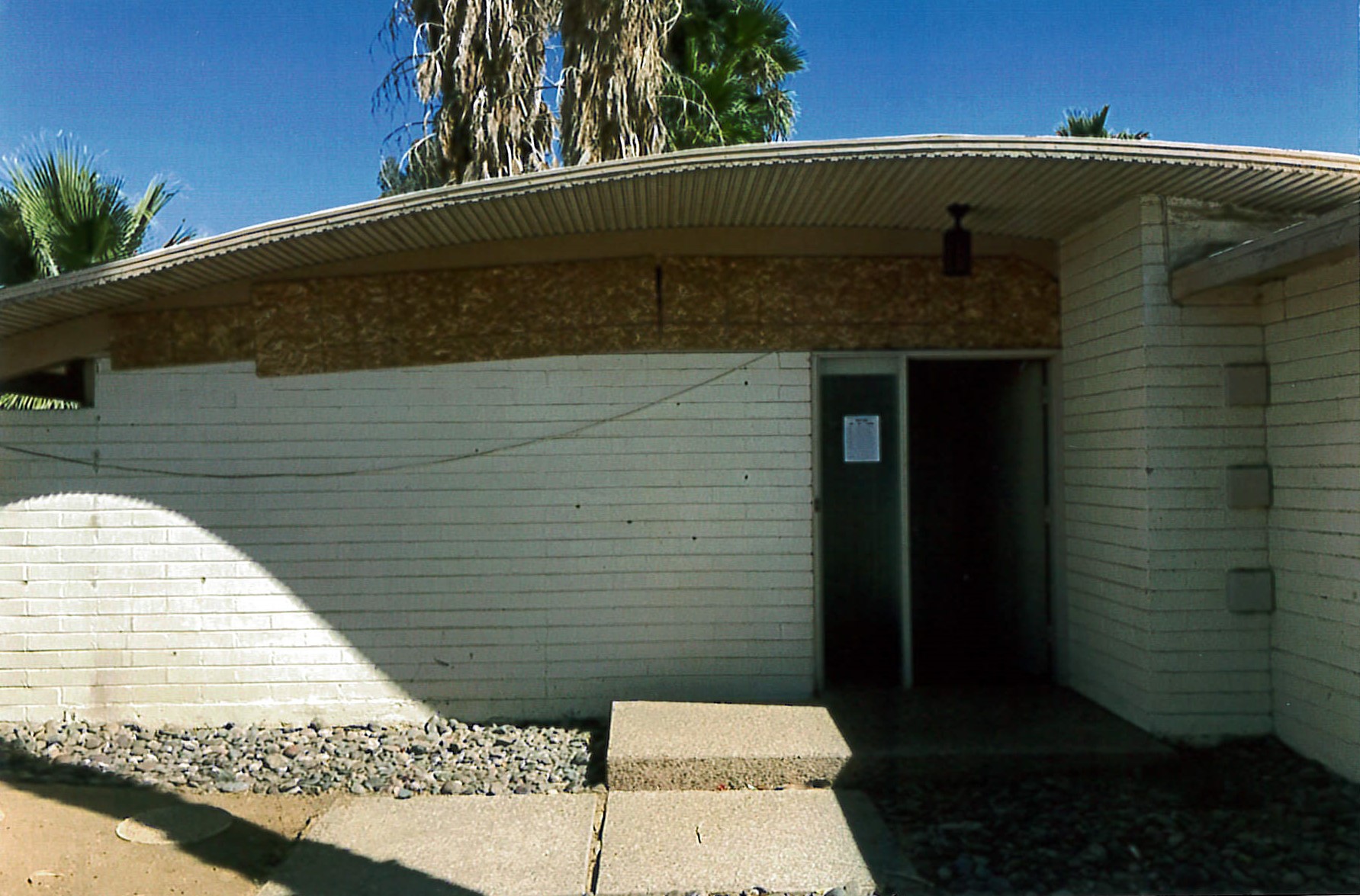 Front exterior of house, slight view of addition to front of house